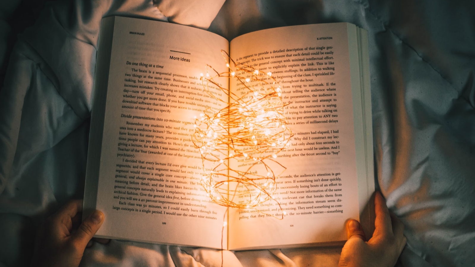 an open book with mini lights on it